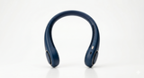 AEROVIBE Pearl White bladeless neck fan worn by woman at cafe – lifestyle product photography
